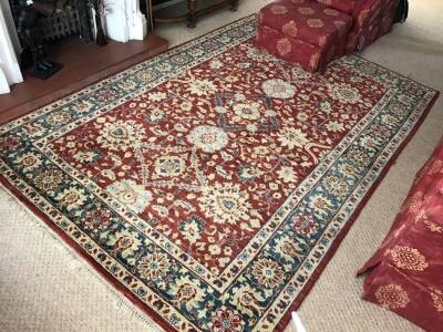 A red ground Persian design rug