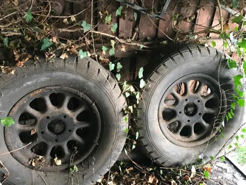 A pair of vintage car wheels.