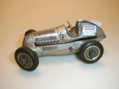 A Schuco Studio clockwork Mercedes (broken back axle)