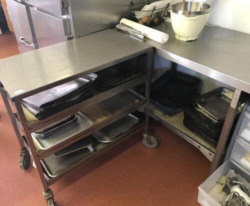 A stainless steel service trolley and two preparation tables