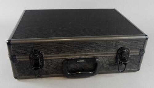 An aluminium and black metal camera case.