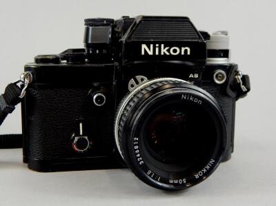 A Nikon camera with Nikkor 50mm lens.