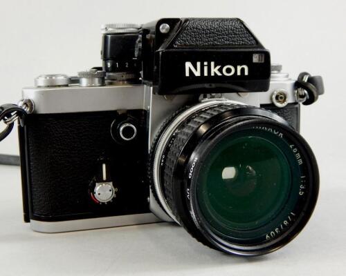 A Nikon camera with Nikkor 28mm lens.