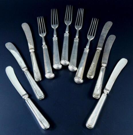 A collection of dessert knives and forks