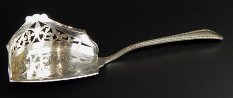 A small silver plated crumb scoop