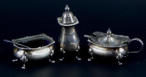 A silver three piece cruet