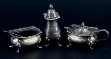 A silver three piece cruet