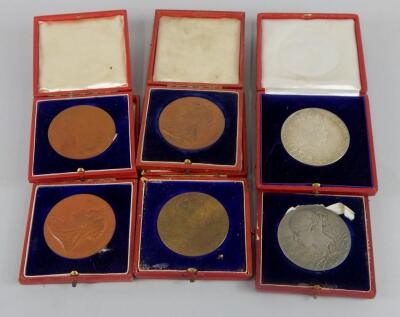 Six bronze commemorative medallions