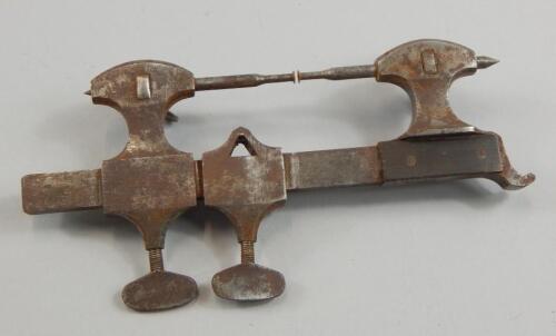 A steel clock or watch maker's clamp