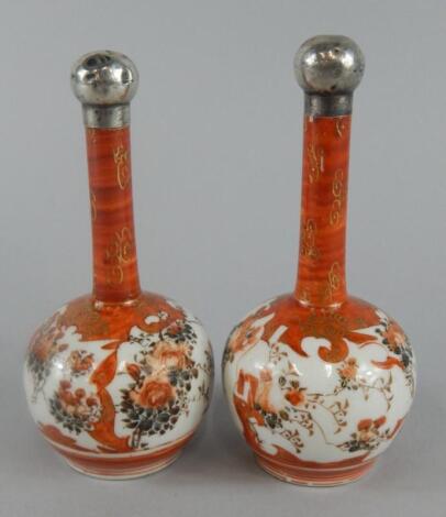 A pair of late 19th/early 20thC Japanese Kutani porcelain bottle shaped vases