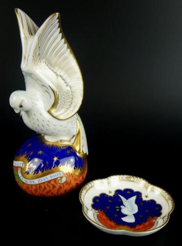 A Royal Crown Derby Spirit of Peace paperweight and associated pin tray