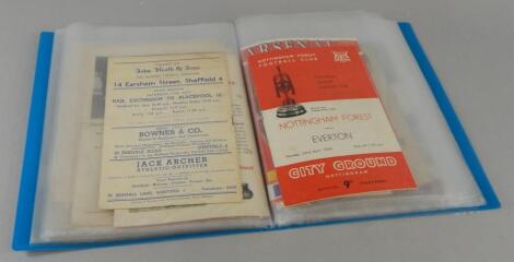 A folder of football programmes