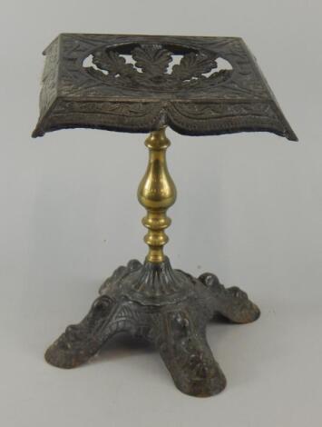 A Victorian cast iron and brass trivet