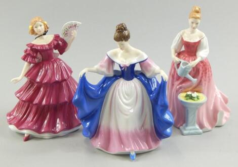 A collection of three Royal Doulton figurines