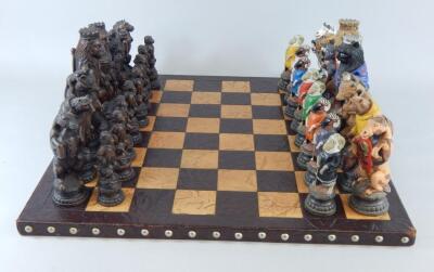 A leather onyx chess set and Reynard the Fox chess pieces