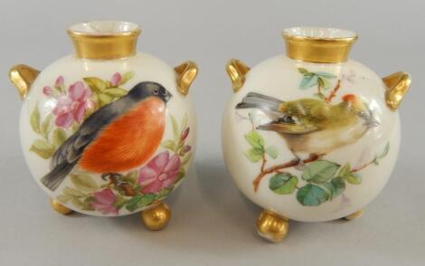 A pair of Royal Worcester globular vases