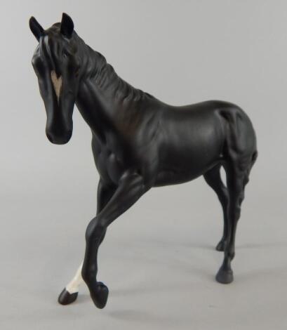 A Beswick matt glazed model of a Stallion