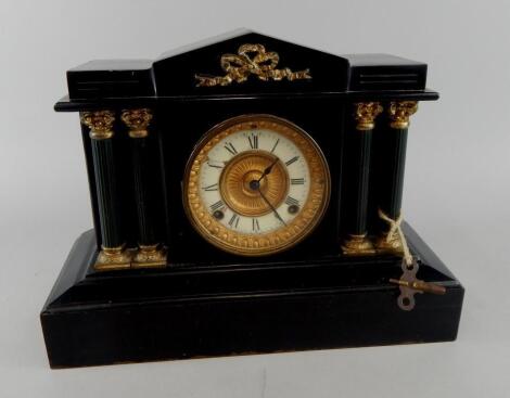 A late 19thC American Ansonia black painted slate mantel clock