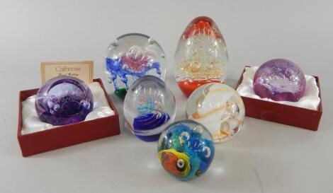 A collection of paperweights