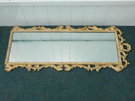 A 20thC rectangular gilt gesso wall mirror