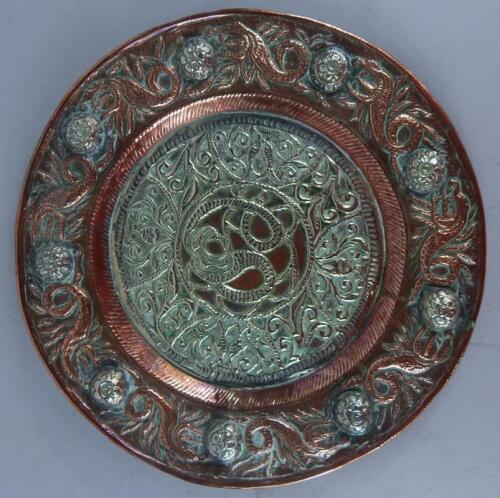 A Middle Eastern copper and silvered plaque