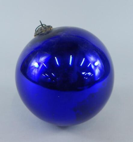 A purple vacuum type glass witches' ball or large bauble