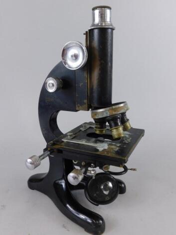 A Beck ebonised brass and steel microscope