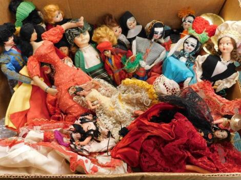 A large quantity of costume dolls