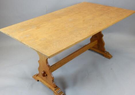 A 20thC light oak refectory table