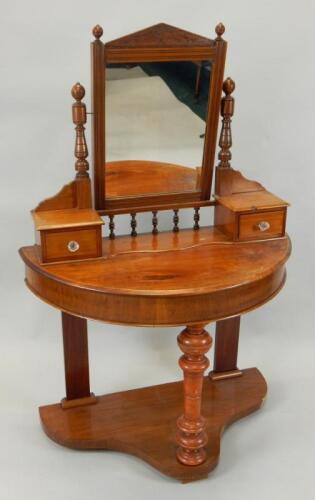 An Edwardian walnut duchess dressing table of small proportion