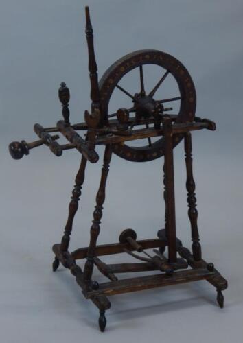 A Continental stained spinning wheel