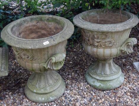 A pair of 19thC style reconstituted garden urns