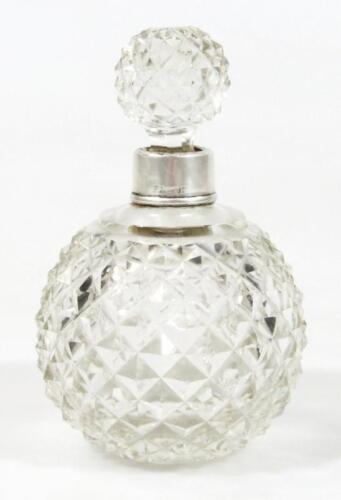 An early 20thC silver and cut glass perfume bottle