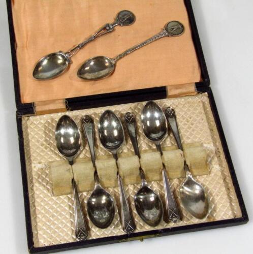 Various silver teaspoons with differing golfing emblems