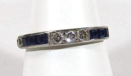 A ladies sapphire and diamond half eternity ring