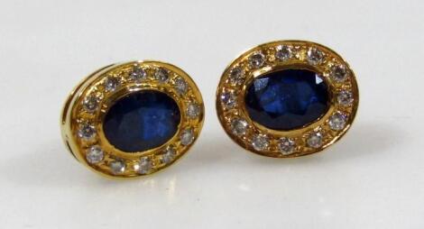 A pair of sapphire and diamond ear studs