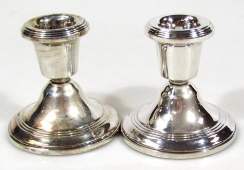 A pair of Elizabeth II silver dwarf candlesticks