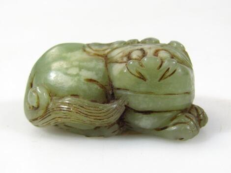 A polished green jade figure of a lion