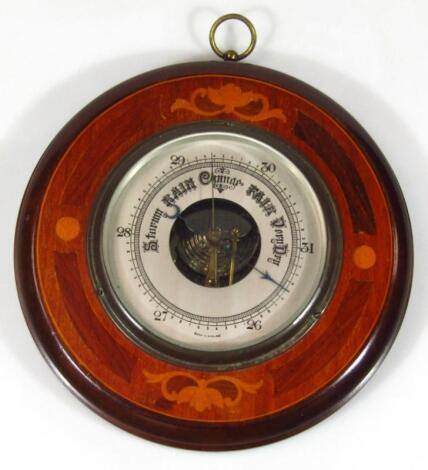 An early 20thC mahogany and marquetry circular hanging barometer