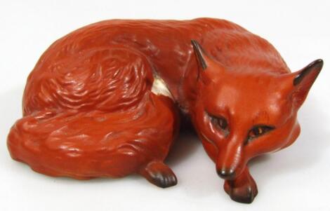 A Beswick pottery matte finish lying fox