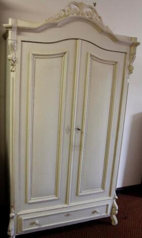 An early 20thC pine French armoire wardrobe