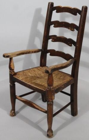 A 20thC ash finish rush seated child's chair