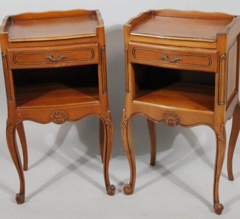 A pair of mid 20thC French bedside cabinets