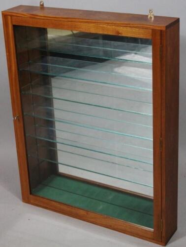 A modern polished wooden die cast hanging display cabinet