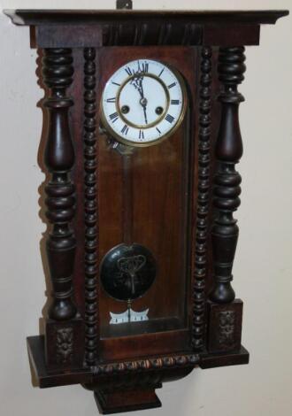 A late 19thC stained mahogany and pine Black Forest wall clock