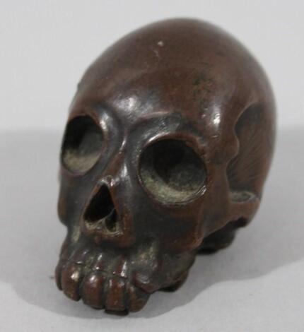 A Meiji period Japanese bronze figure of a skull