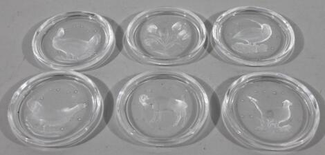 A set of early 20thC etched and clear glass coasters