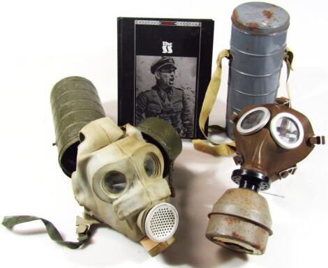 Two gas masks in fitted tins