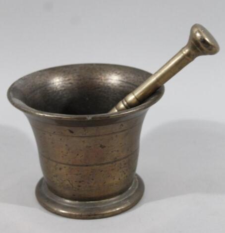 A bell metal pestle and mortar