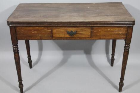 An early 19thC mahogany fold over tea table